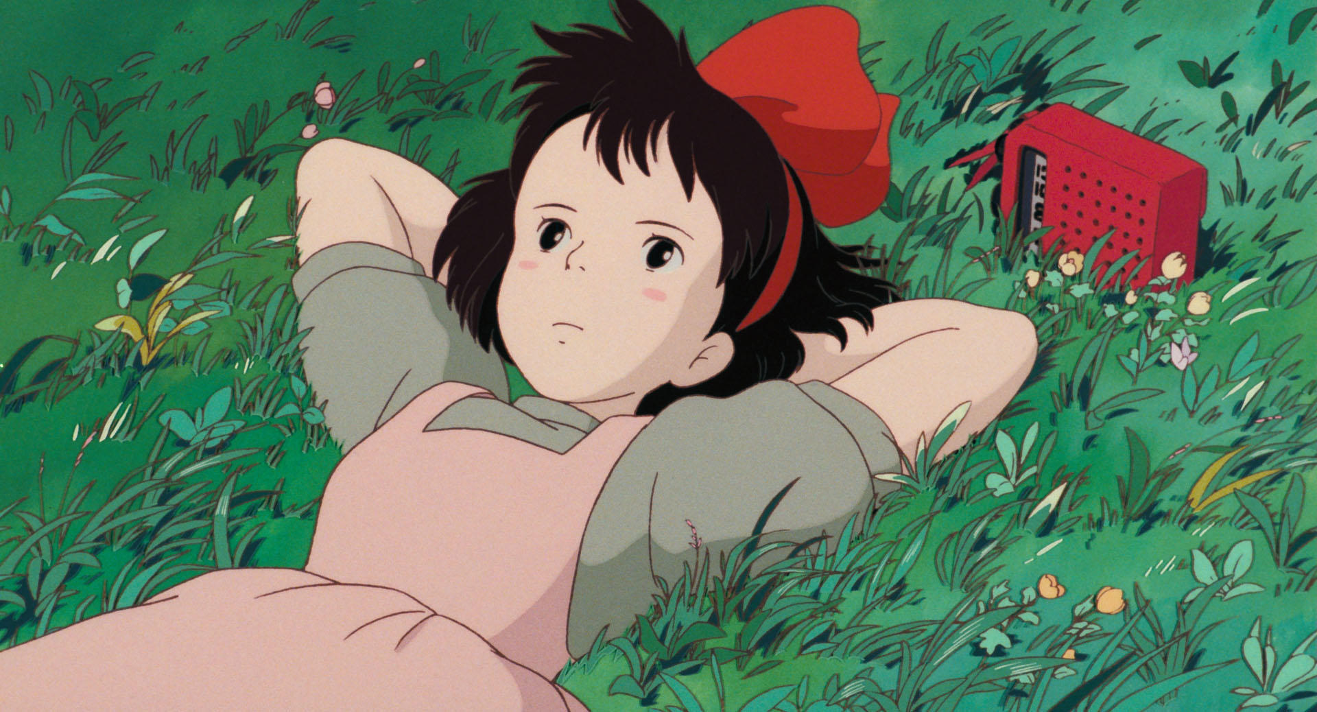 Kiki flying on her broom in an official Kiki’s Delivery Service still