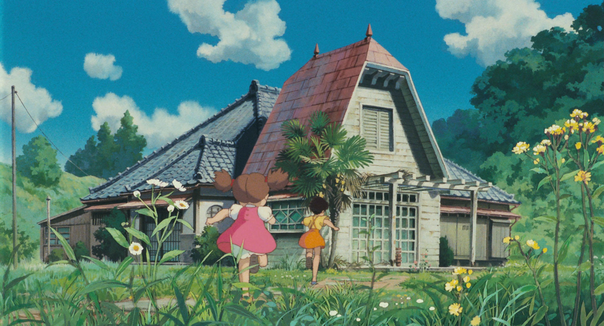 Satsuki and Mei in the countryside in My Neighbor Totoro