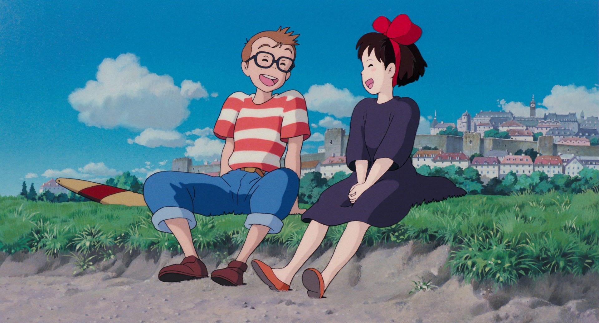 Kiki flying through the sky in an official Kiki's Delivery Service still from Studio Ghibli