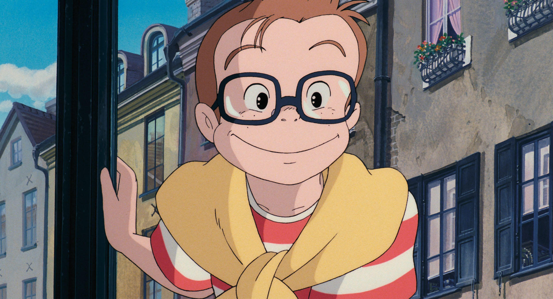 Kiki flying through a cloudy sky, an official Studio Ghibli still from Kiki’s Delivery Service