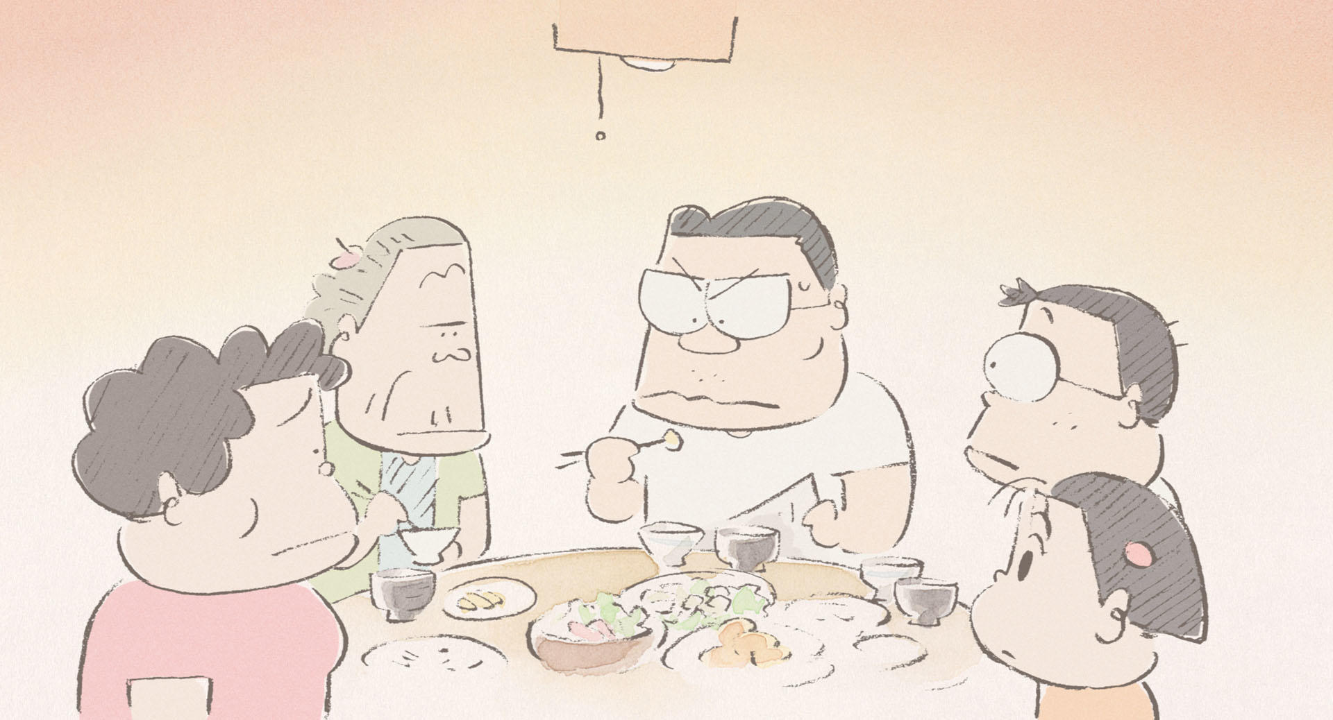 Members of the Yamada family gathered around a table in an official film still