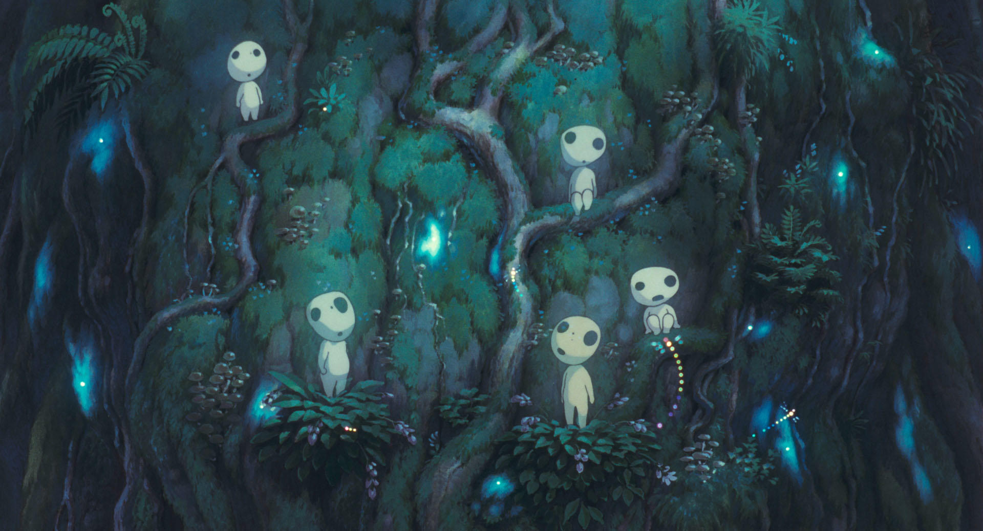 Small white tree spirits gather among dark green forest plants in Princess Mononoke