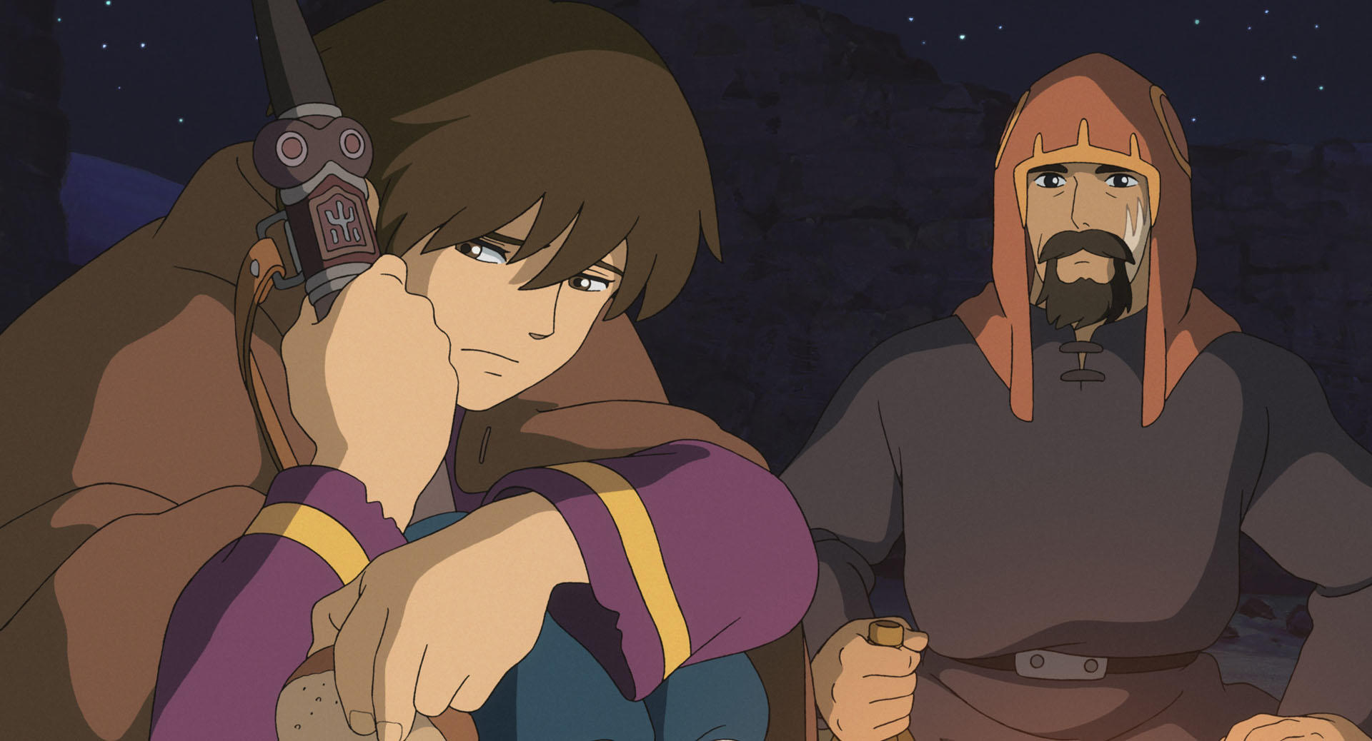 Two travellers resting beneath a dark sky in an official still from Tales from Earthsea