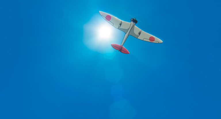 An aircraft crossing a clear blue sky in an official still from The Wind Rises