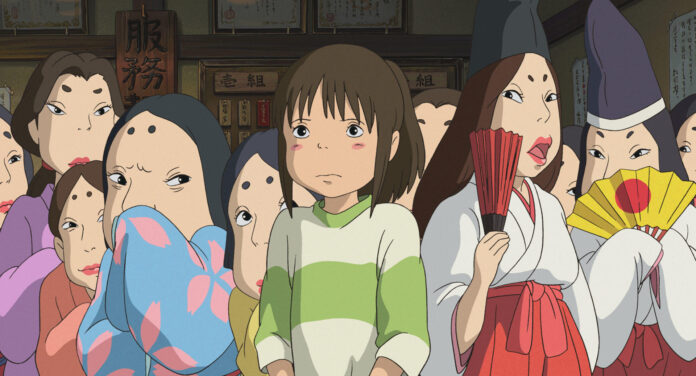 Chihiro standing in a Studio Ghibli scene from Spirited Away, used for an explainer about whether Studio Ghibli movies are anime.